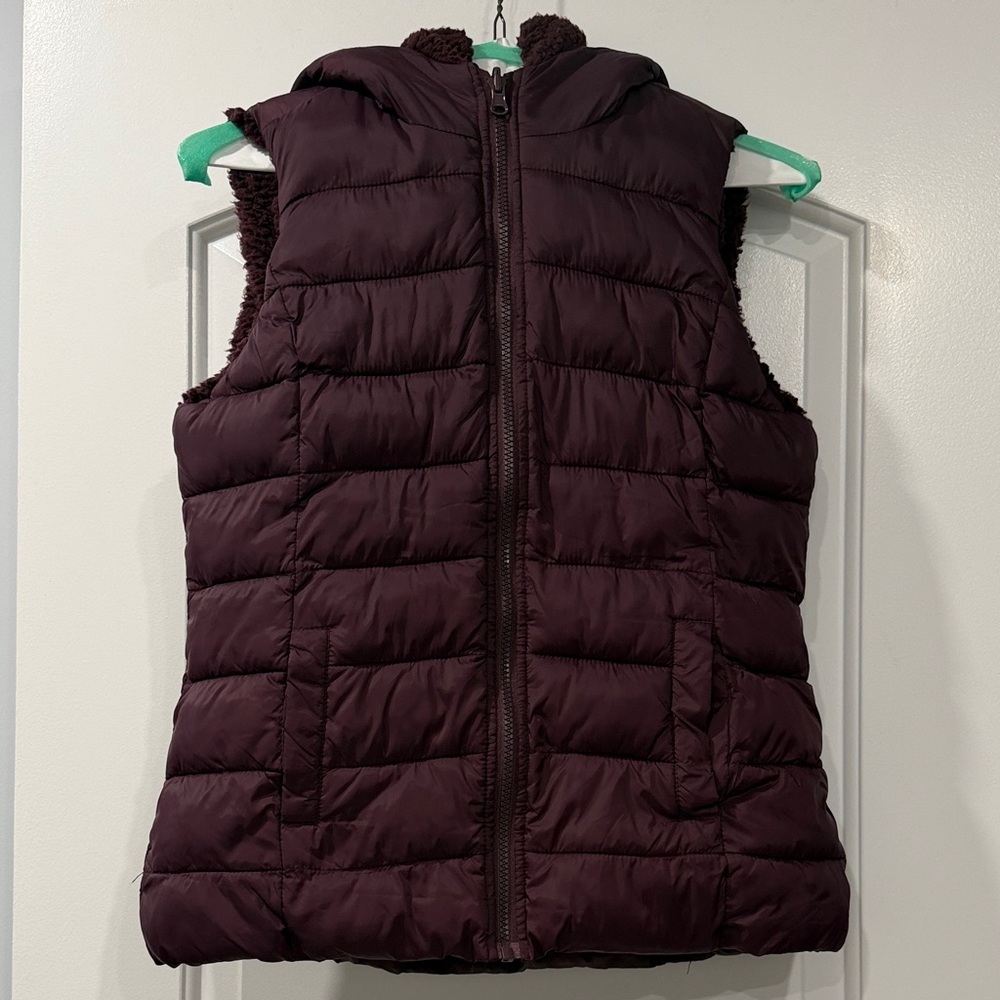 NY & Co Women’s Hooded Puffer Vest in Deep Plum with Sherpa Lining.